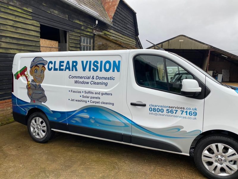 Clear vision services car parked outside house